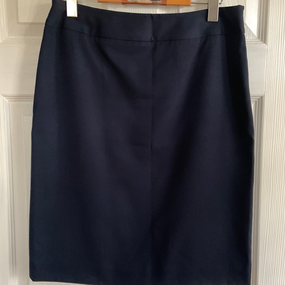 Navy skirt, classic styling. Rarely worn. Like new.